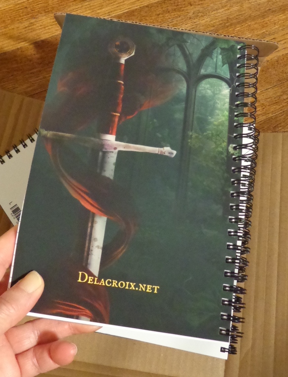 Spiral bound notebook with the cover illustration for The Hunter & the Heiress